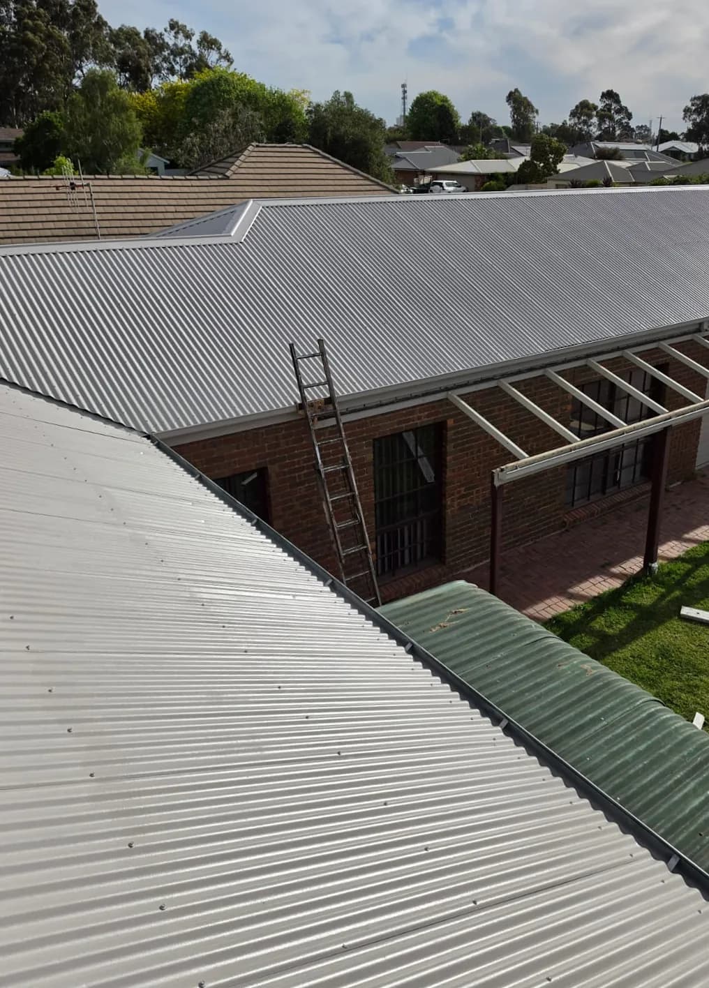 The same roof from the same spot, repainted in a light grey, after